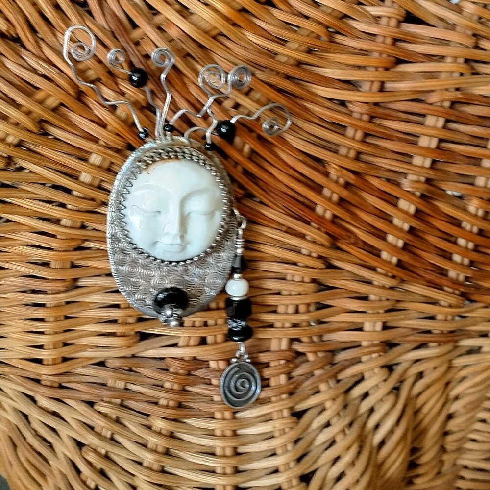 Moon face brooch; sterling setting, carved moon face, jet beads, kooky hair